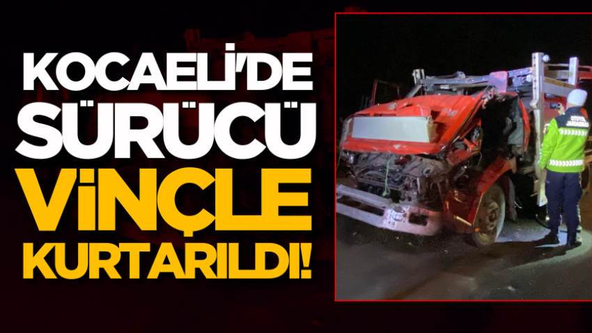 Kocaeli'de sürücü vinçle kurtarıldı!