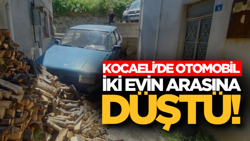 Kocaeli'de otomobil iki evin arasına düştü!